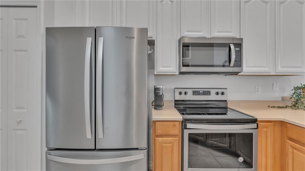 Double door top refrigerator with bottom freezer.