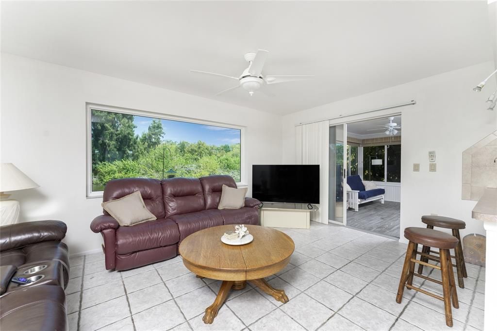 Family room has tiled flooring and offers a great view of the Lake!
