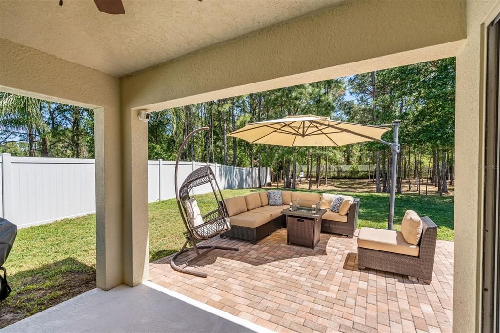 Outdoor patio and extended brick paver lanai