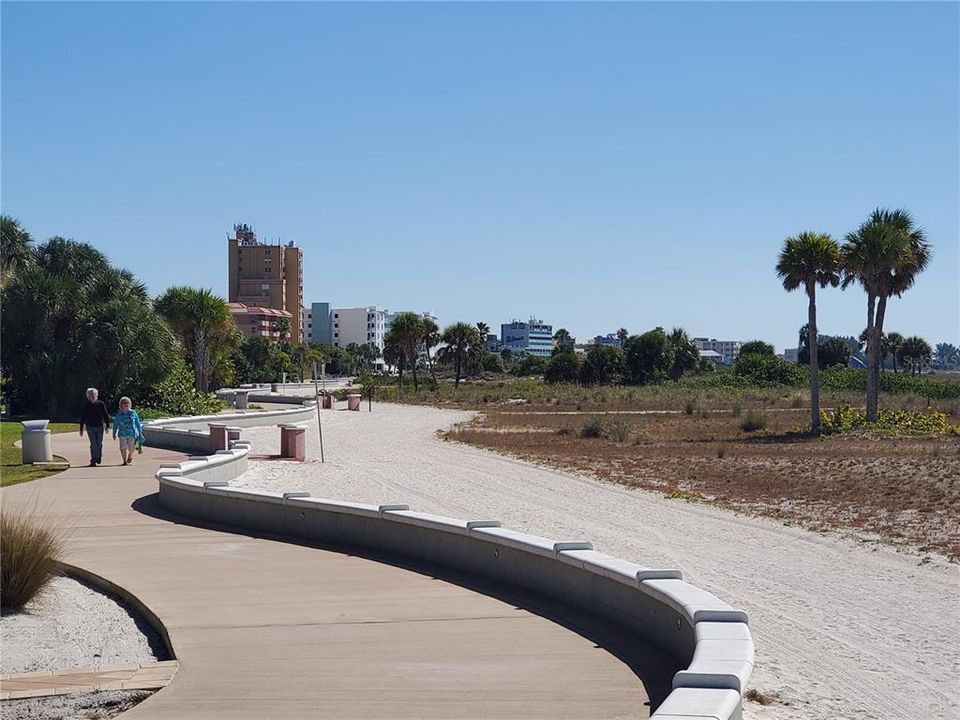 .85 mile long  double-wide walkway of smooth concrete runs parallel to beautiful Treasure Island Beach
