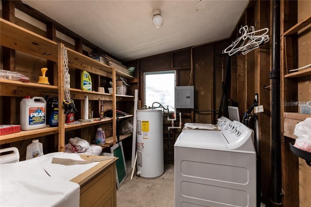 The laundry room offers lots of additional storage