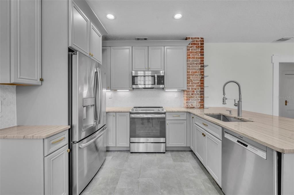 Main floor kitchen layout designed with enthusiastic cooks in mind. Fridge, wash, cook, repeat!