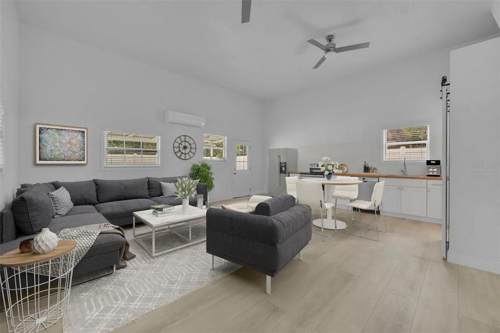 This VIRTUALLY staged photo displays just how comfortable living in this space will be. PLEASE NOTE: the refrigerator (and all other furnishings) depicted in this image are digital images and are not included in the sale of this home.