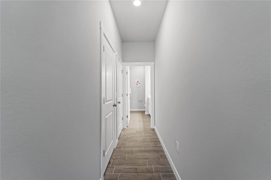 Hallway to primary bedroom