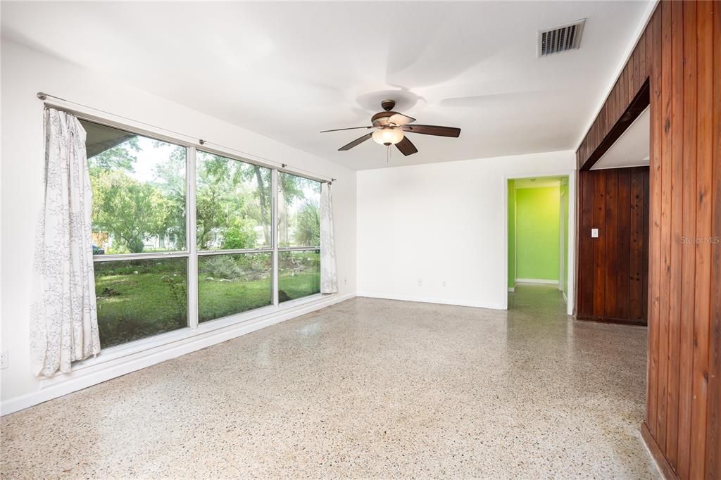 Terrazzo floors and large bank of picture windows