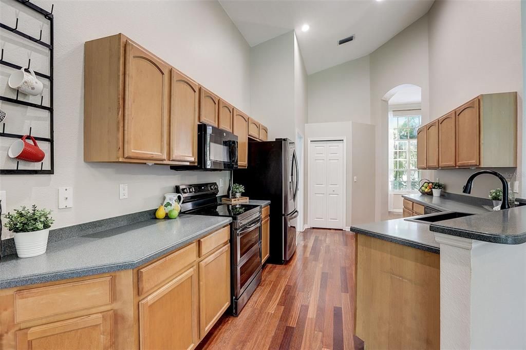 Kitchen with updated stainless steel appliances overlooks the family room!