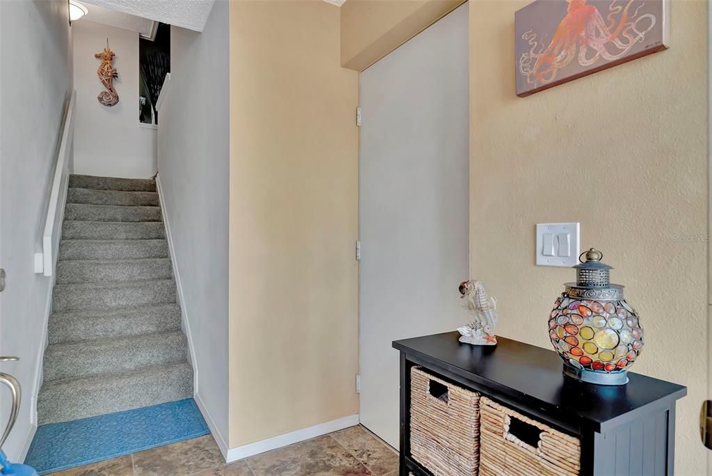 Entry way from front door leads to the garage and up to the main living floor.