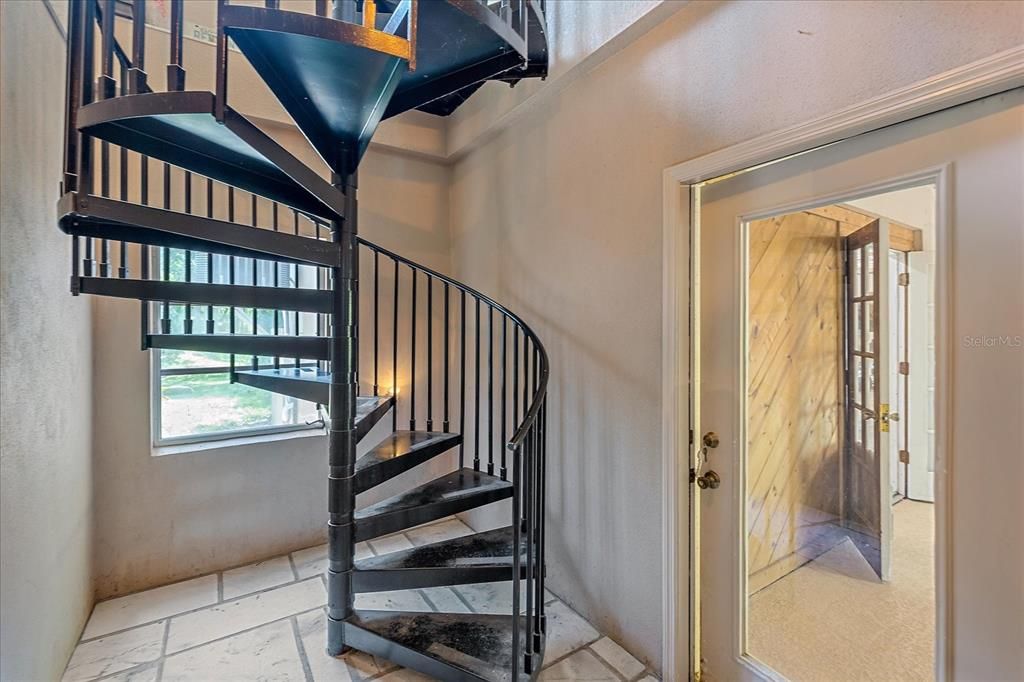 Spiral staircase from the garage