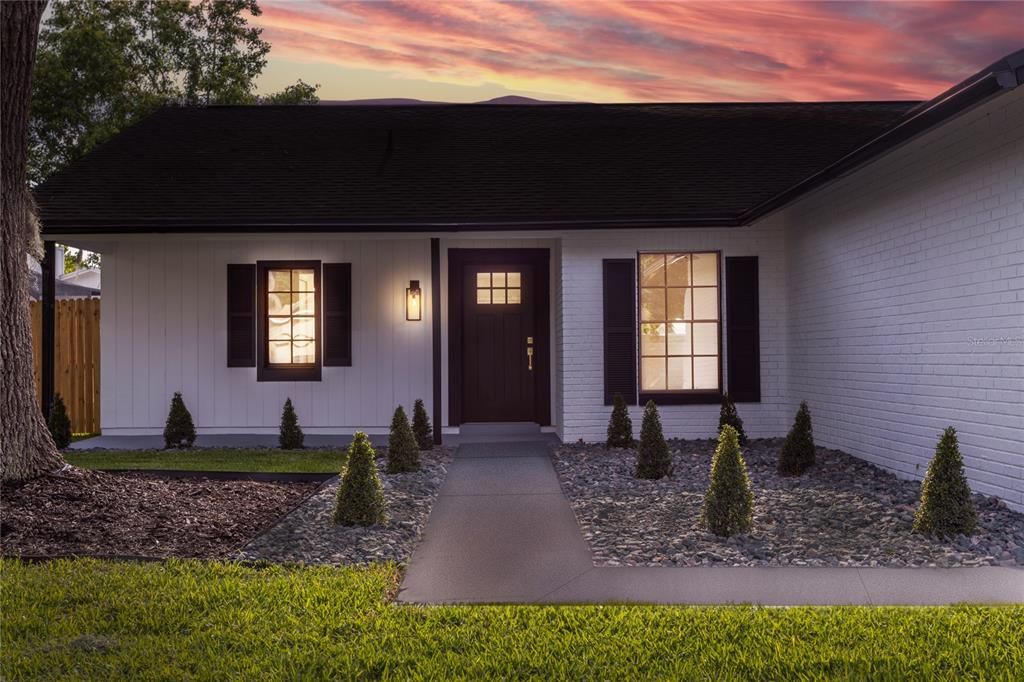 The curb appeal combines a sleek blend of contemporary and rustic elements providing a grand entrance, while the freshly painted exterior gives the home a crisp, inviting look.