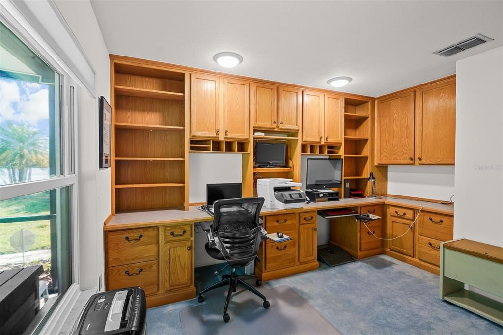 Custom-designed built-in office: double work stations w/(8) file drawers, (2) 5-shelf bookcases, (2) lower cabinets, large  corner cabinet, (4) drawers, (4) double-door upper cabinets, (2) monitor nooks, TV nook, Central Printer Nook & 13-ft. countertop