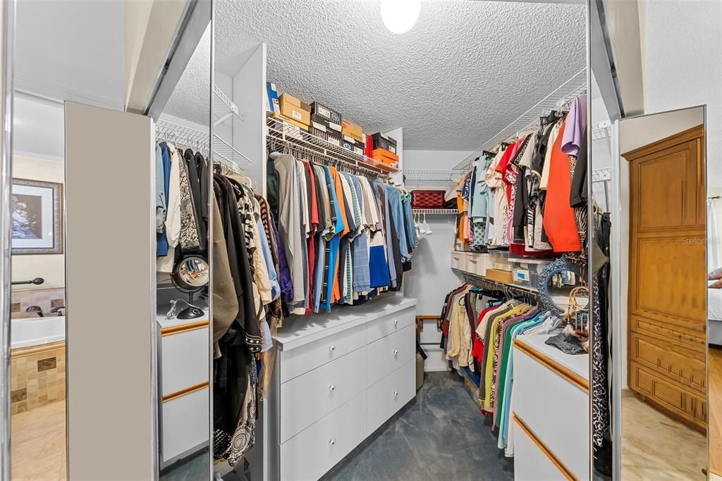 Spacious master closet with lots of storage and room.