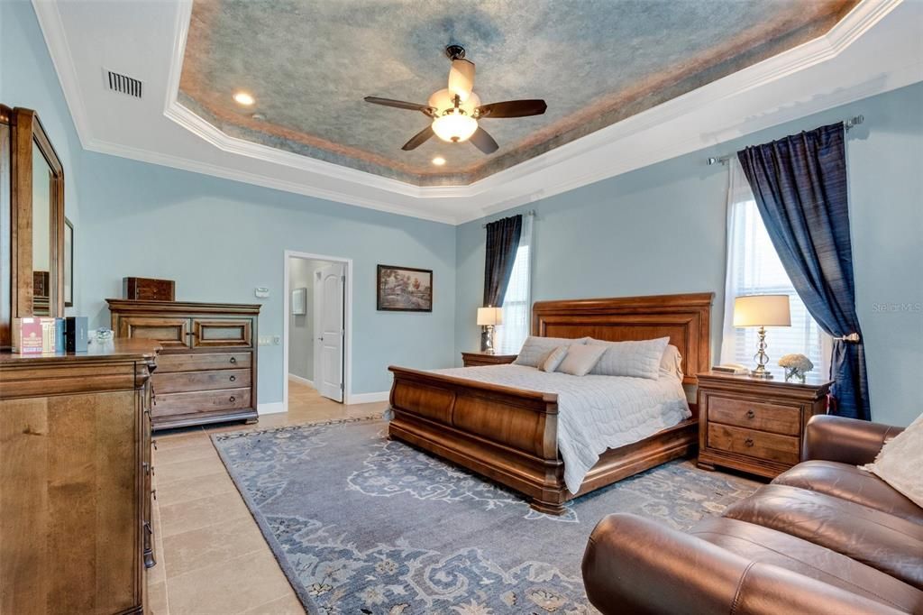The owners suite, has a private entrance to the pool, his & her walk-in closets, tray ceilings and a en-suite master bath.