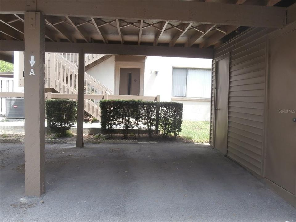 Covered parking space with storage closet