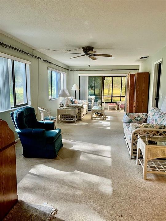 Beautiful sunny living room with golf course view.