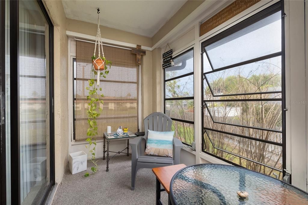 Large enclosed balcony with storage closet