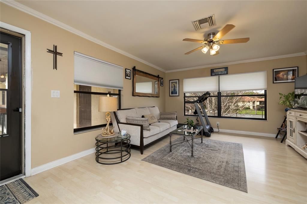 Living room with window overlooking the Tennis Court