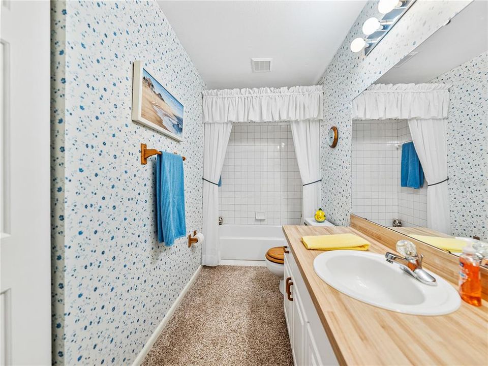 Bathroom #2 has a tub and shower and is located between bedroom #2 and bedroom #3.