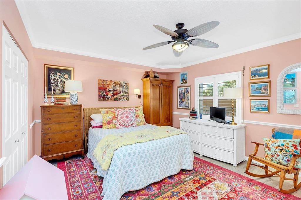 Fresh and Clean and Large secondary bedrooms -- this one with a walk in closet! Notice the PLANTATION SHUTTERS, chaor rail and crown mouldings!!! Guest bedrooms sure to PLEASE!!
