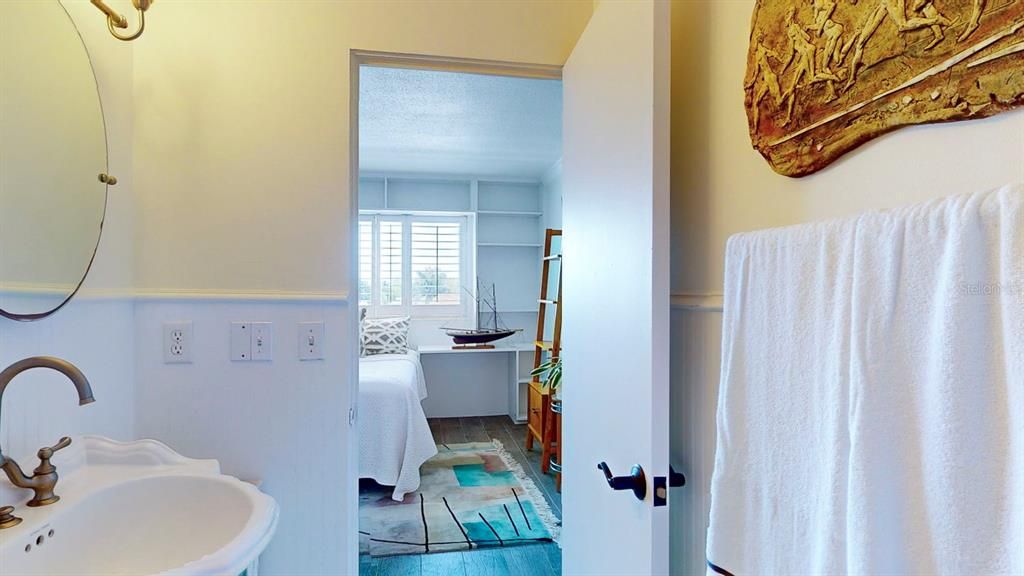 Guest bath is ensuite and has washer and dryer as well as a large walkin closet.