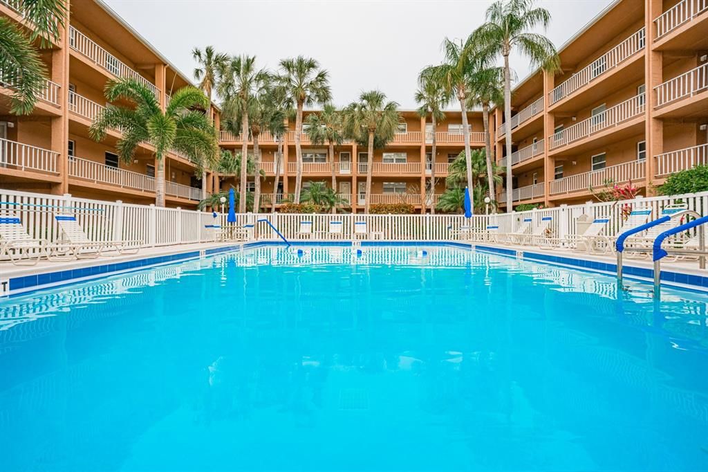 Community pool with plenty of seating