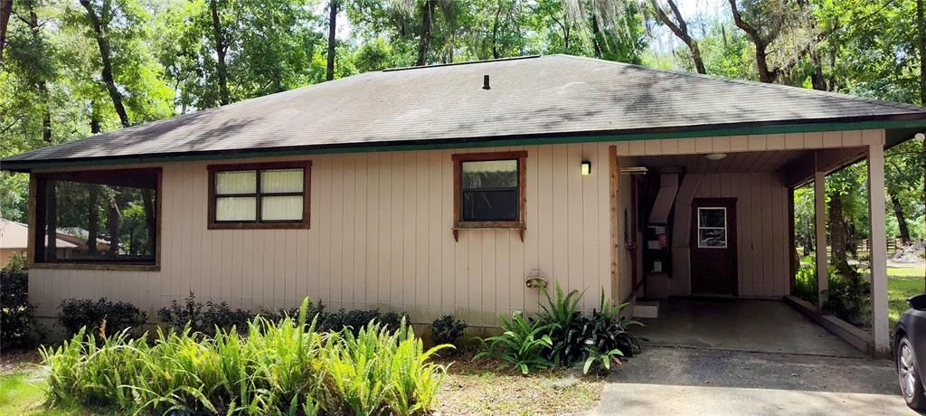 Guest House with Carport, screened porch, its own laundry room and outside shower