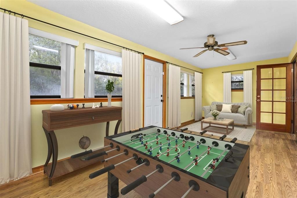 Virtually Staged sunroom as game room