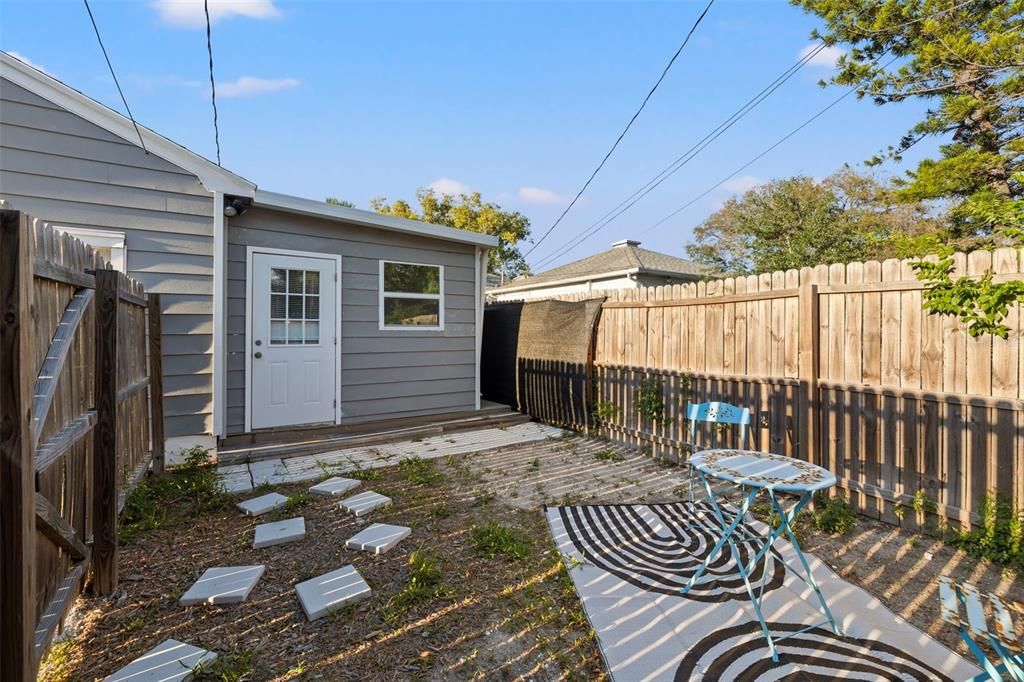 Private entry and fenced yard