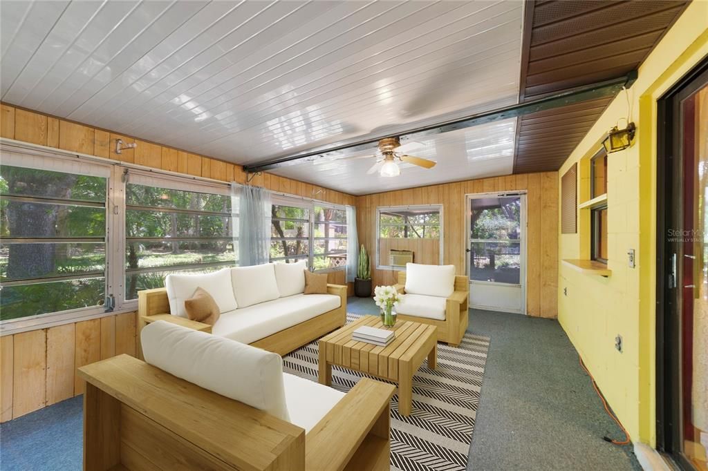 The enclosed Florida room gives you additional light and bright flexible space with access to a backyard filled with beautiful mature trees. Virtually Staged.