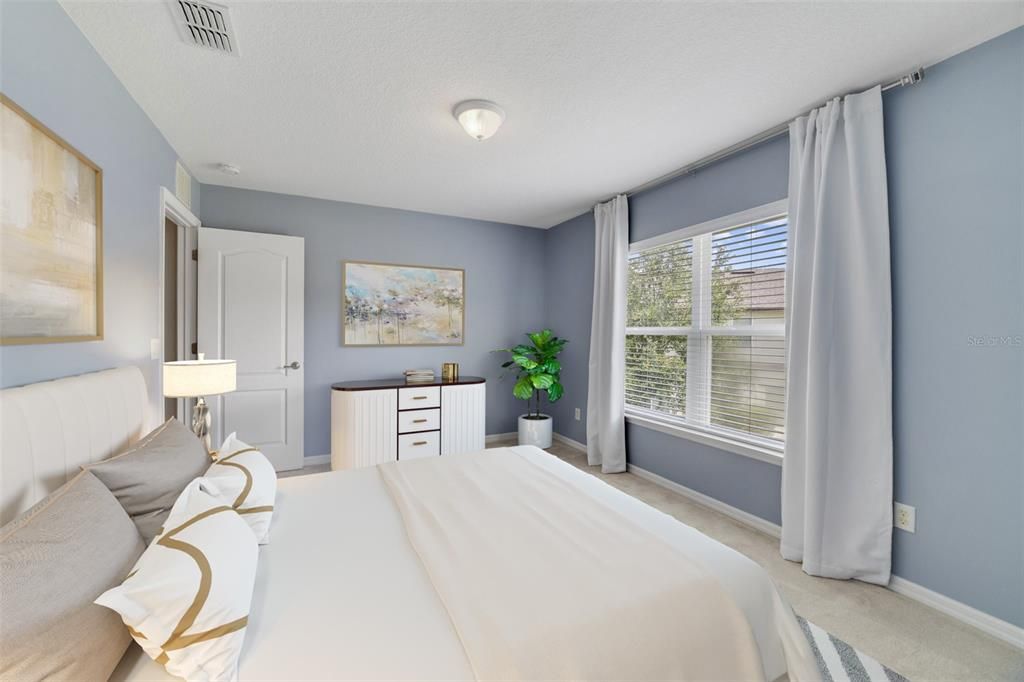 Upstairs offers another light and bright space in the generous PRIMARY SUITE, with twin windows that overlook the front of the home, WALK-IN CLOSET and private en-suite bath.
