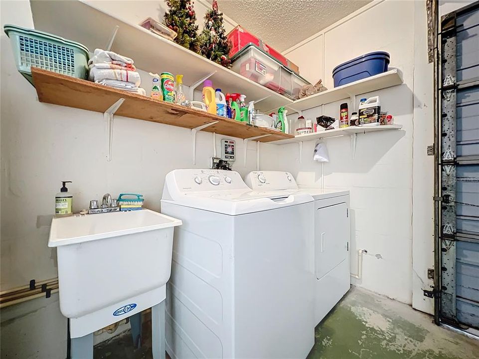 Laundry is located in the garage together with a utility sink