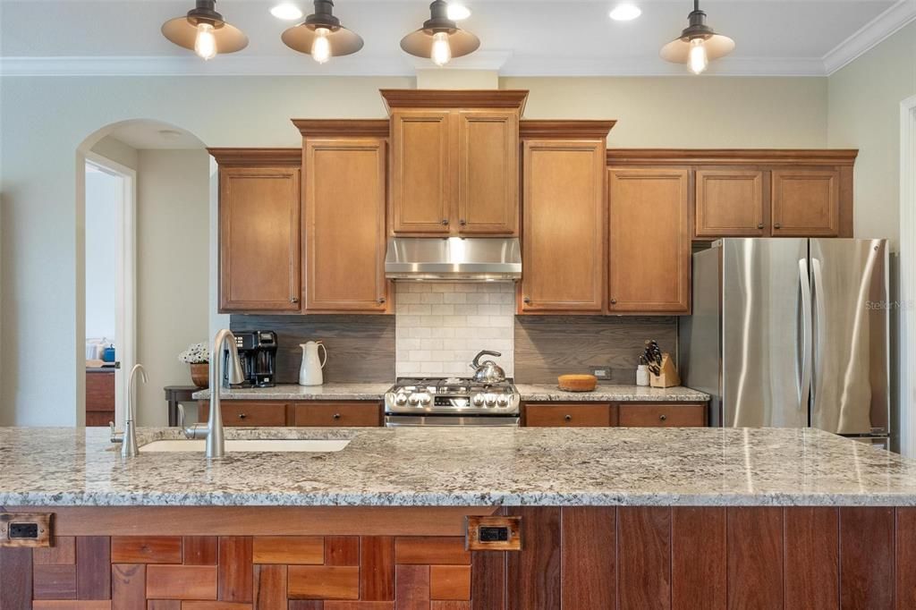 Custom bar, custom backsplash, and inviting warm colors will let you know you are "Home".