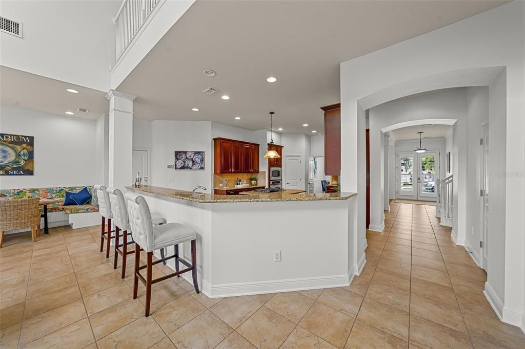 Wrap-around kitchen counter connects the kitchen to the family room for convenient entertaining.