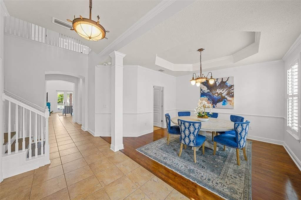 Entrance Foyer with Dining Room on right, and study/office on left. Center hall opens to two story family room.