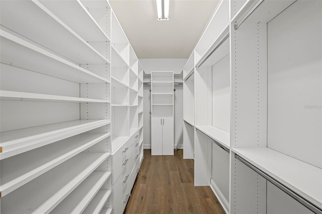 Expansive Master closet with customized built-ins for premium organization.