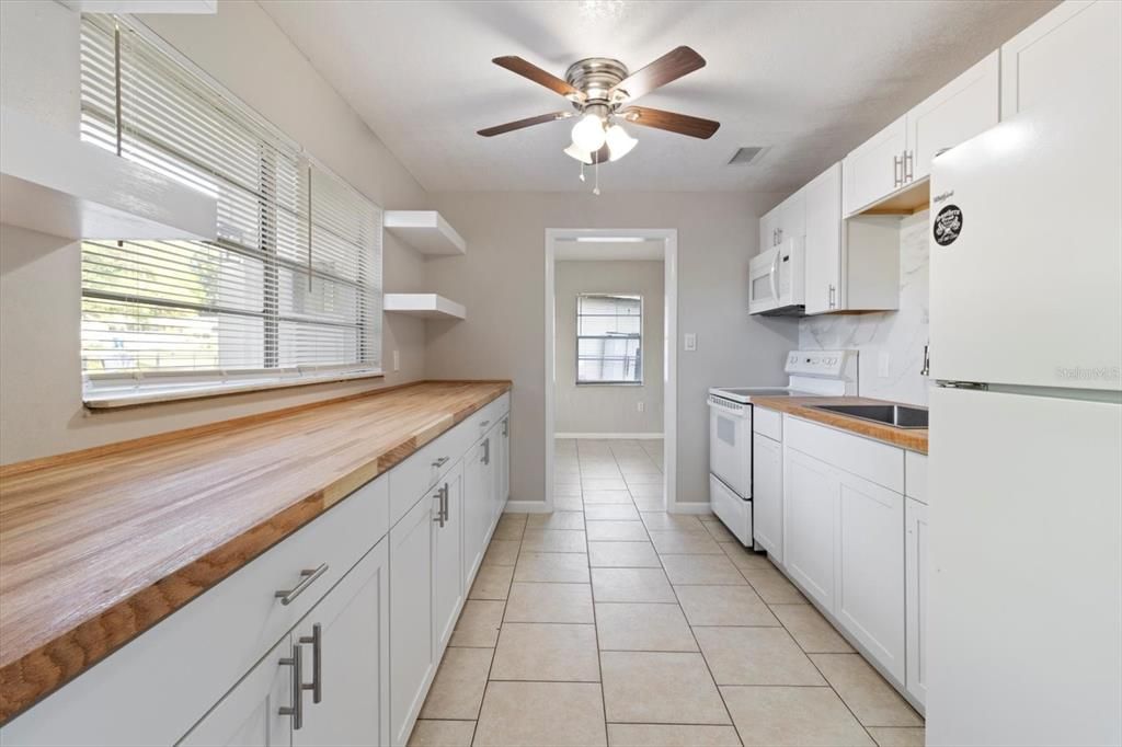 Galley Kitchen with NEW: White Shaker Cabinets & Handles & NEW Butcher Block Countertops