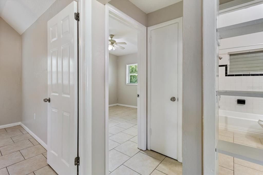 Hallway with Linen Closet Leading to Bedrooms and Bathroom