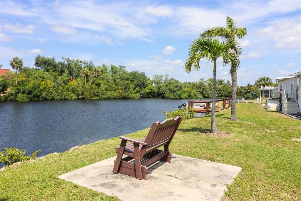 Enjoy the view from Park bench along the waterway