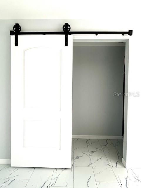 Barn door gives privacy to the master suite