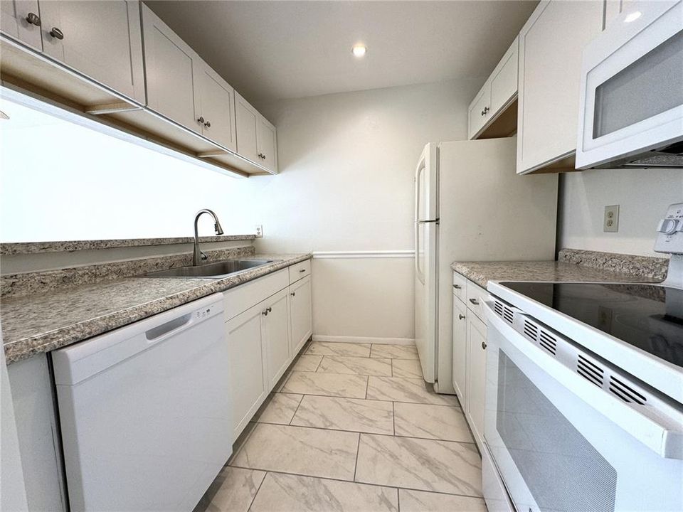 Updated kitchen. New flooring, countertops, cabinets and dishwasher.