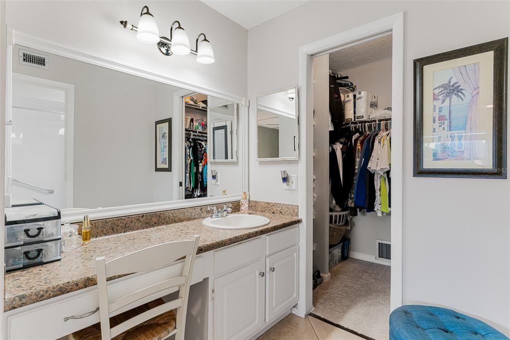 Primary ensuite vanity and walk in closet