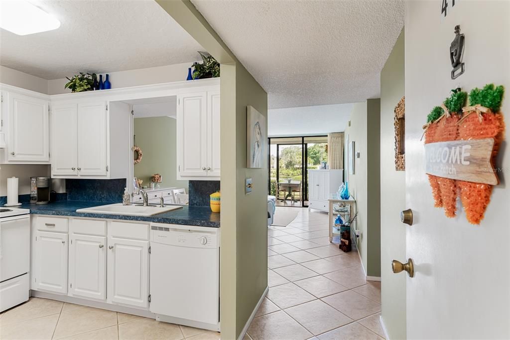 Entry way with kitchen off to the side