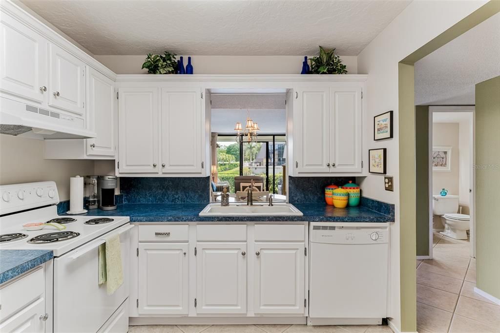 Kitchen with view of dining and living area