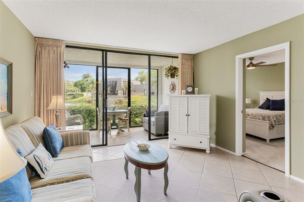 Living area with patio access and lake views