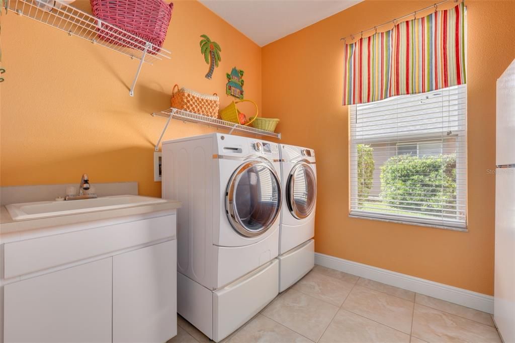 Large inside laundry with sink and REFRIGERATOR!