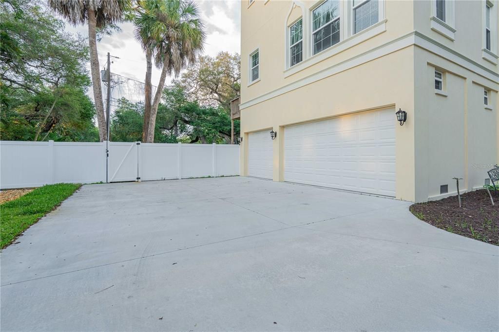 Three car garage and ample space for boat or RV parking.