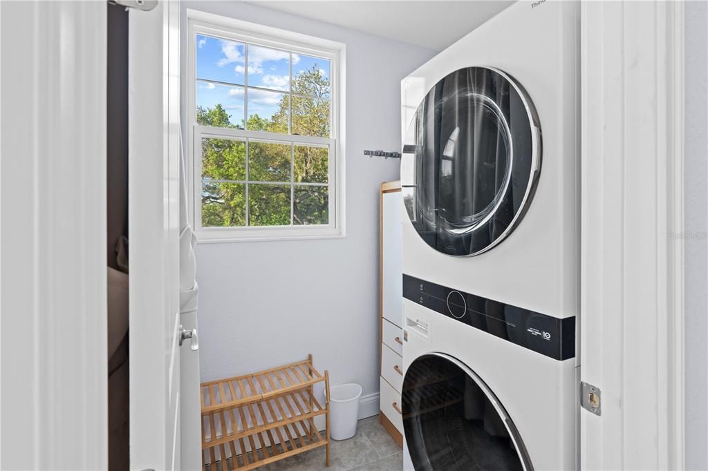Laundry room is conveniently located on third level near bedrooms.