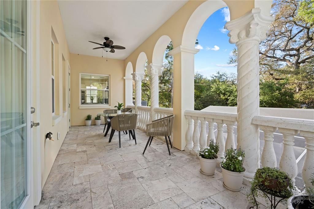 Expansive terrace off dining area overlooks the pool.