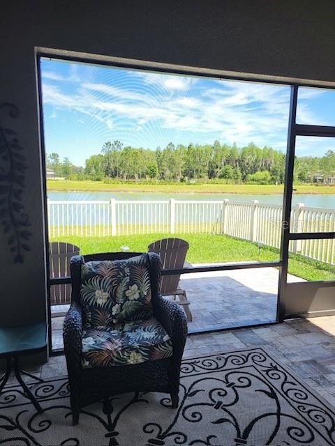 Screened back porch overlooking scenic pond