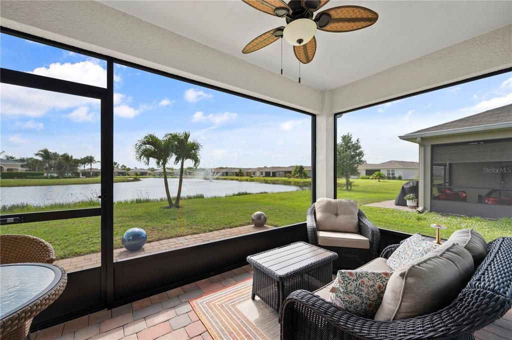 Screened Lanai with view of lake with fountain