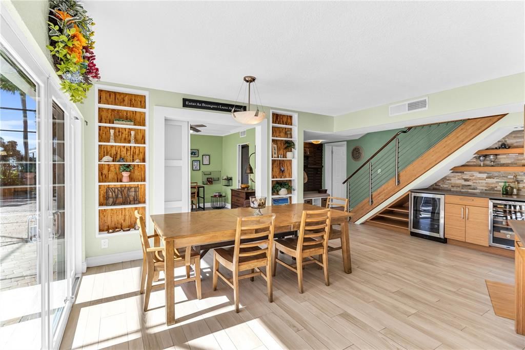 Dinning room with a bar area and two wine fridges.